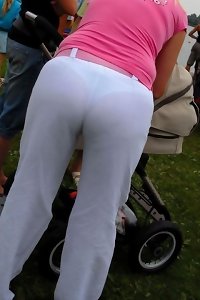 a naked ash-blonde dame is toying with her furry udders on the bed